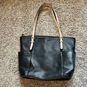 Michael Kors black leather purse with tan strap